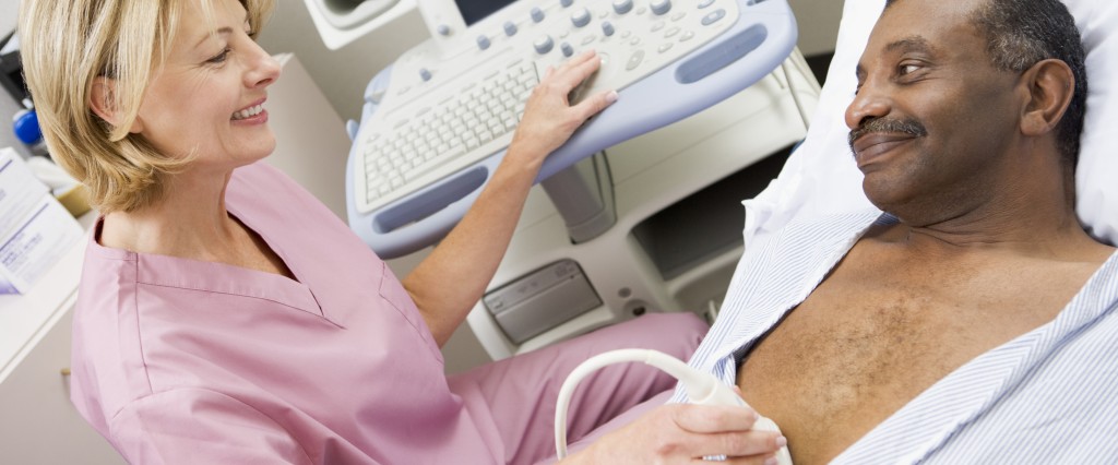 Ultrasound Technician performing an ultrasound on patients chest.