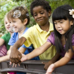 Picture of children playing with bubbles.