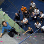 Picture of students rock climbing.