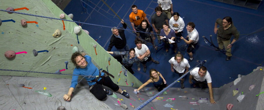 Picture of students rock climbing.