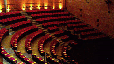 Picture of the Carlson Theatre with red stadium seating