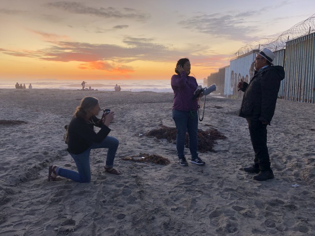 Yuko Kodama conducting an interview at the border