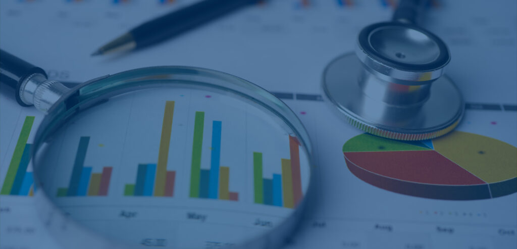 Stethoscope over business reports