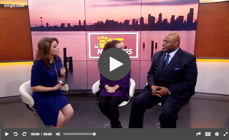 A King 5 news reporter interviews two people on set.
