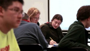 Sara in a classroom with other students