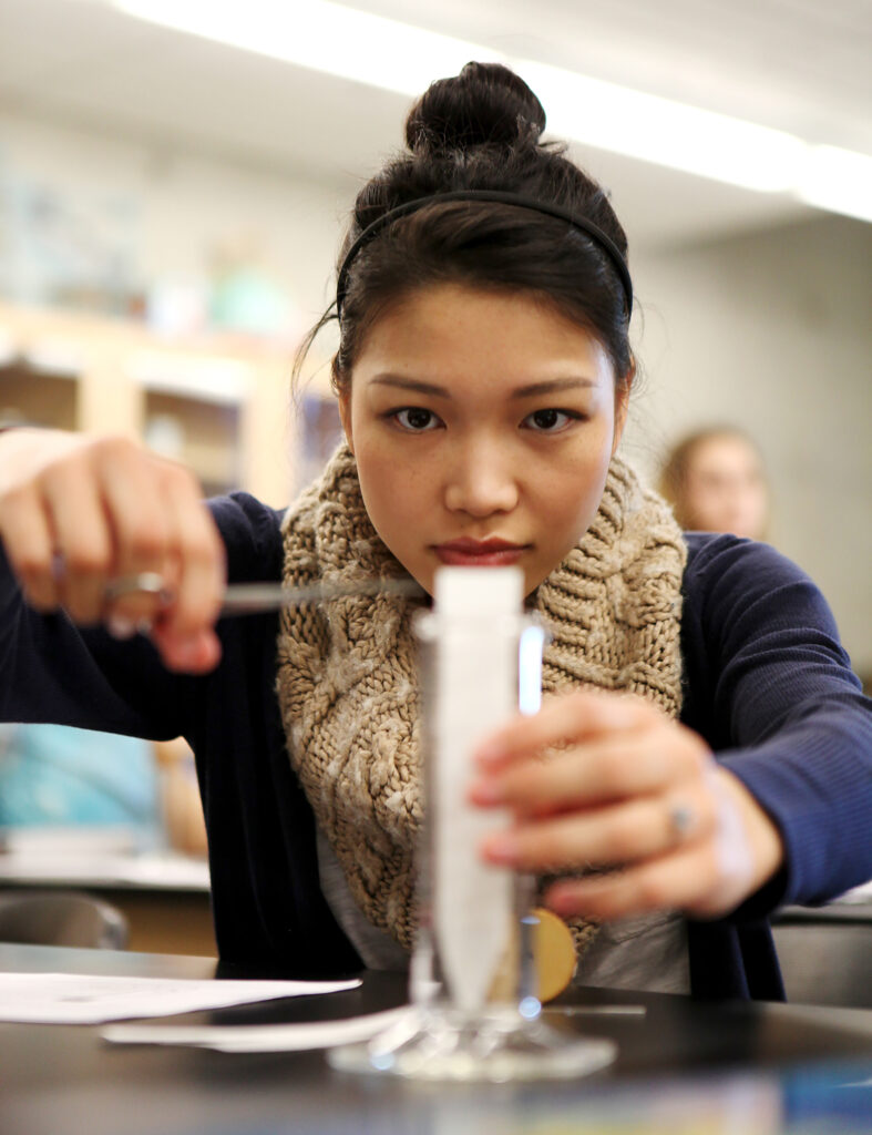 Student using a bunsen burner