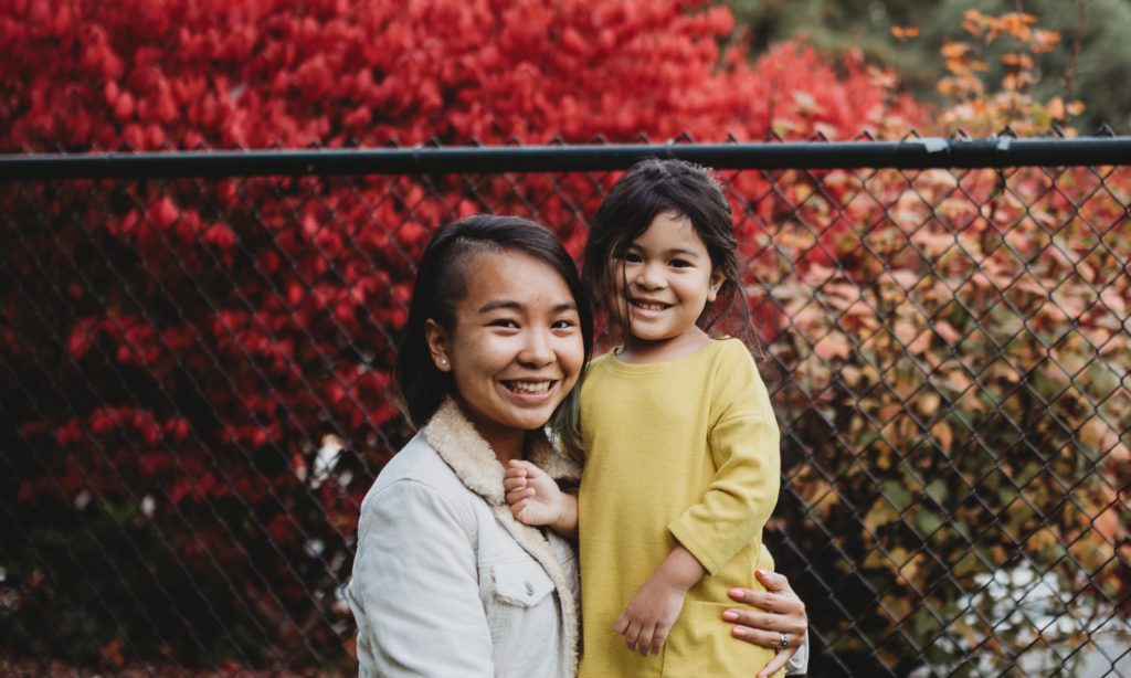 Mother and Daughter posing together.