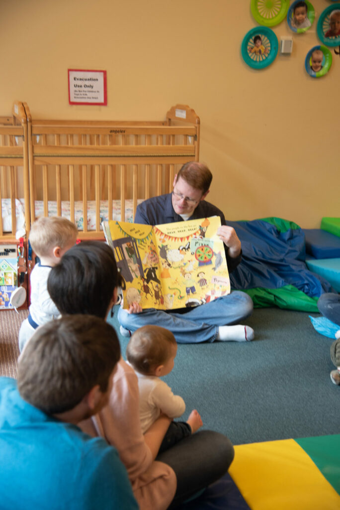 Teacher reading to toddlers