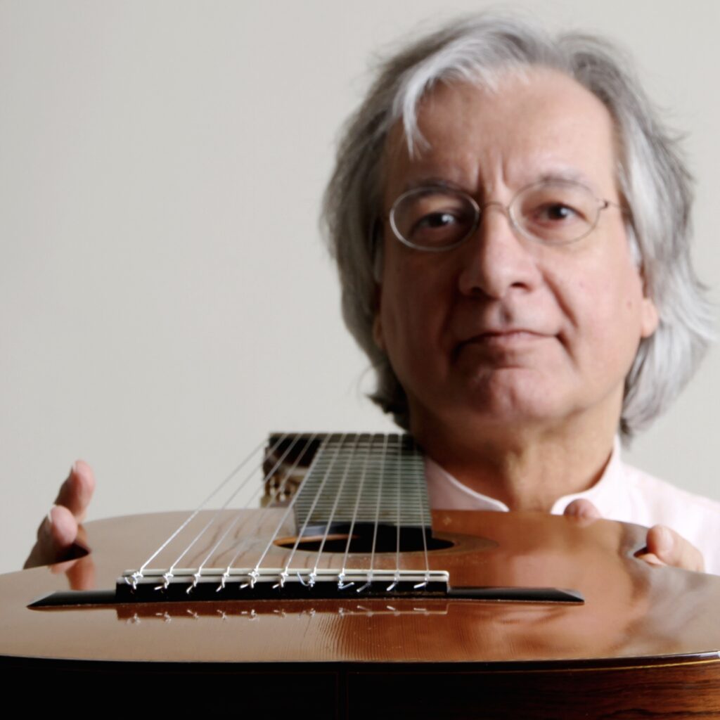Alvaro Pierri holding his guitar