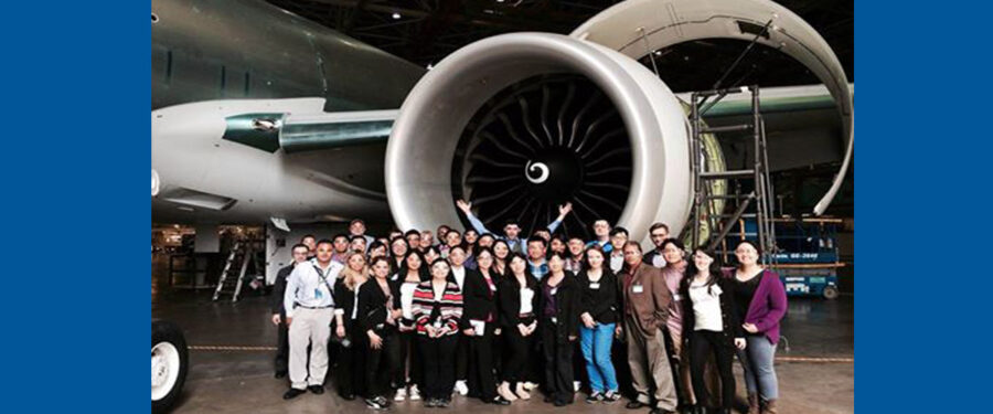 group of students behind the Boeing Plane at the Boeing Field