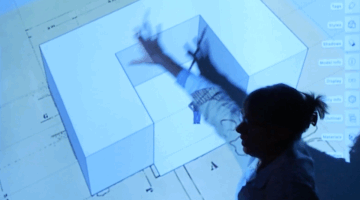 Interior design faculty presenting at an XR Lab demonstration.