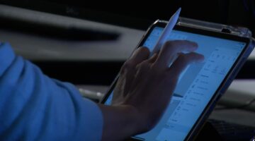 Hand on iPad with tablet pen. Faculty demonstrating Sketchup.