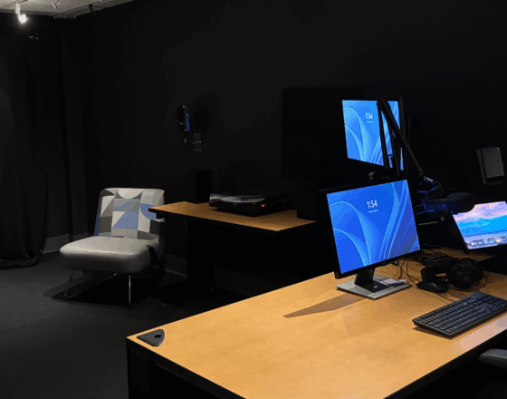 Studio Q featuring desk for video editing, podcasting, and a table for animation.